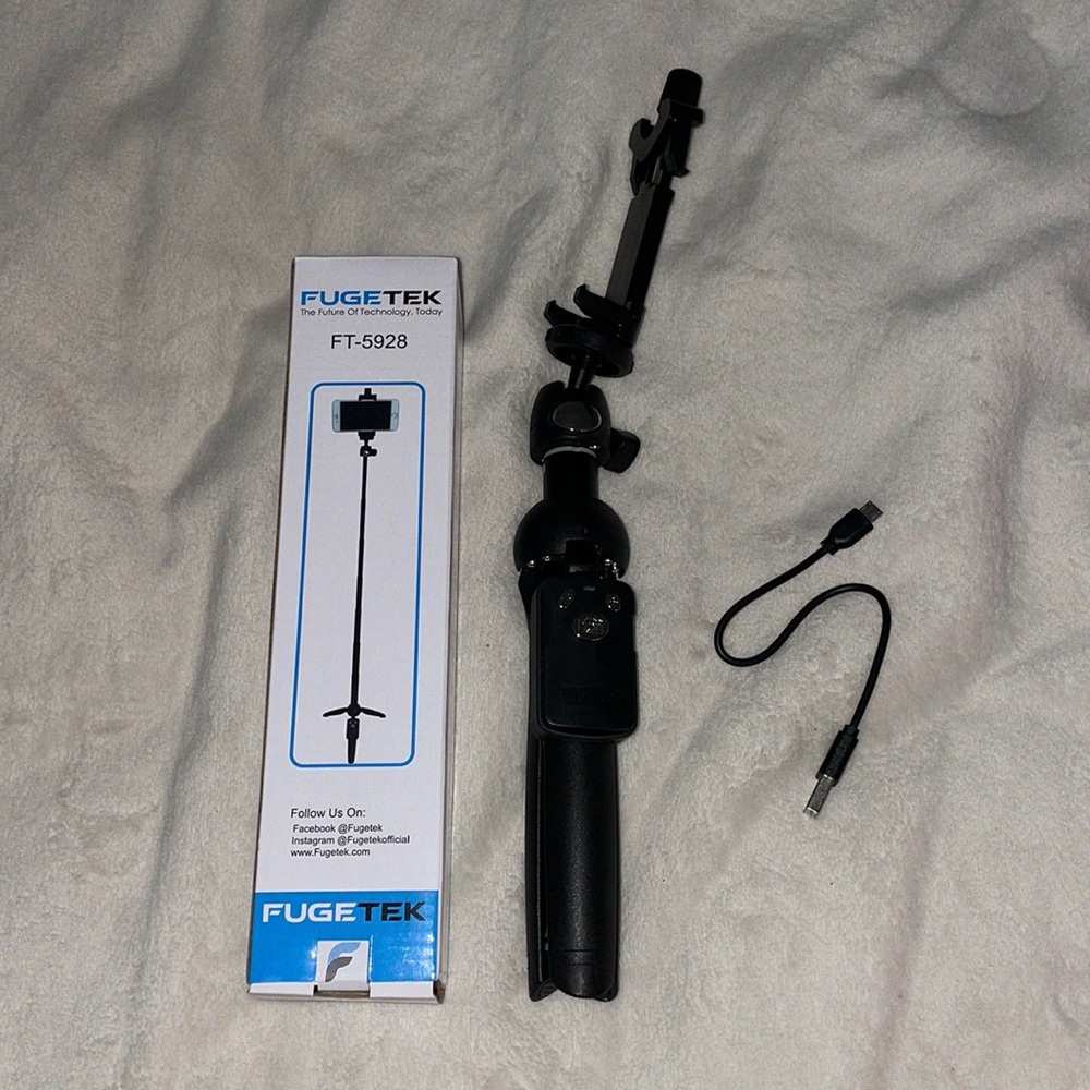 New in box Travel Tripod with Bluetooth Remote